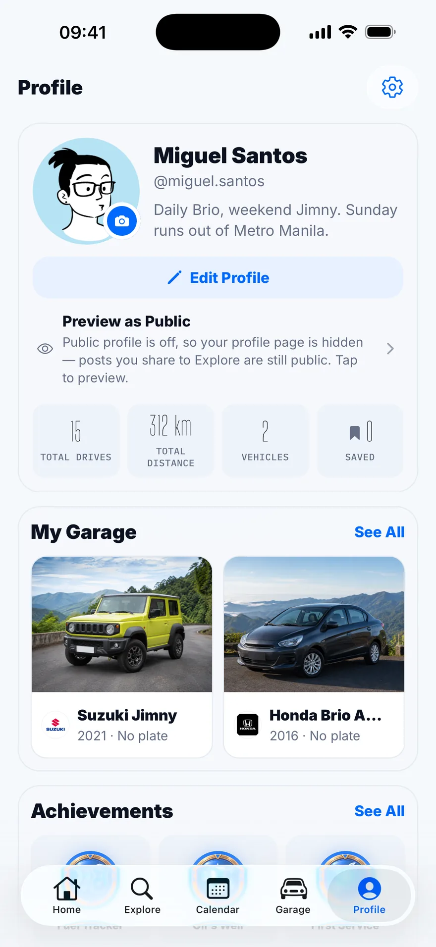 A garage of two cars, a Suzuki Jimny and a Honda Brio Amaze.